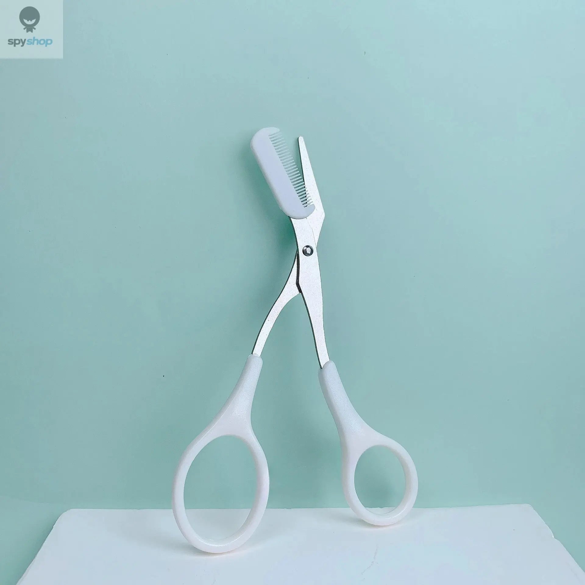 Pink eyebrow trimming scissors with built-in comb - stainless steel, precise grooming tool, creating perfect eyebrows Spy-shop.com