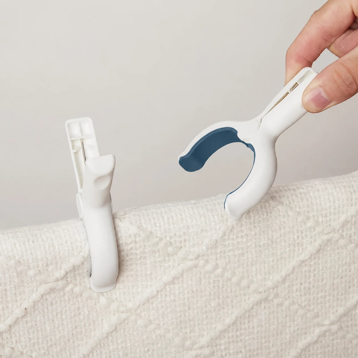 Padded clips gripping a towel