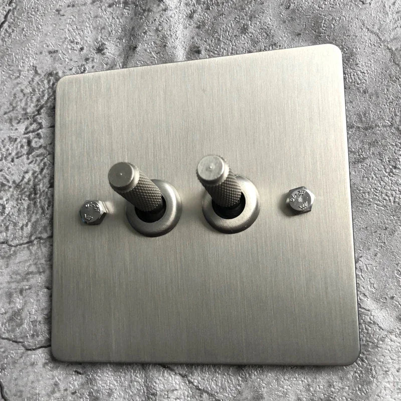Interruptores de pared, enchufes y accesorios de acero cepillado