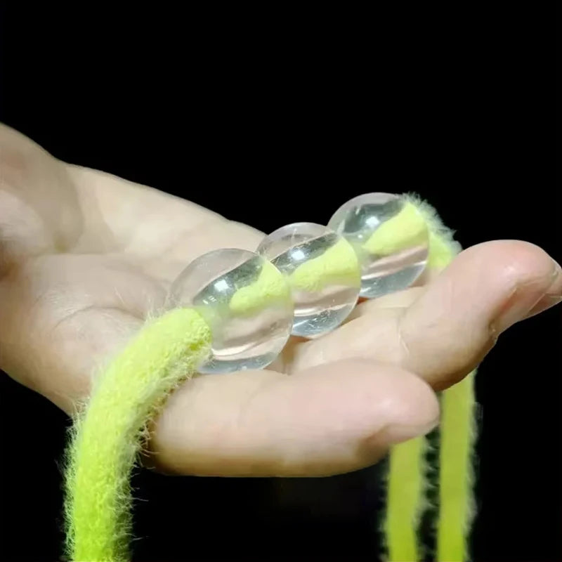 Rope-Through-Balls Magic Prop