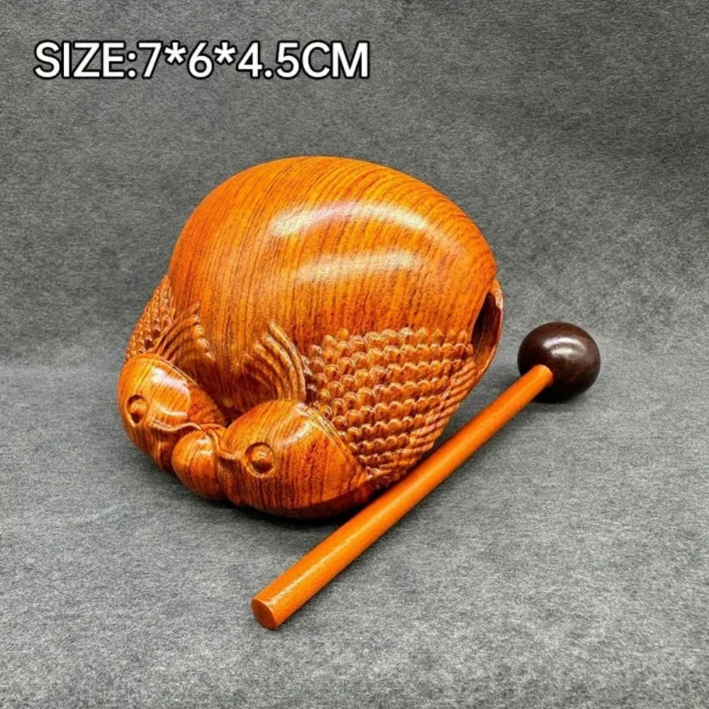 Pequeño instrumento de percusión de pez de madera