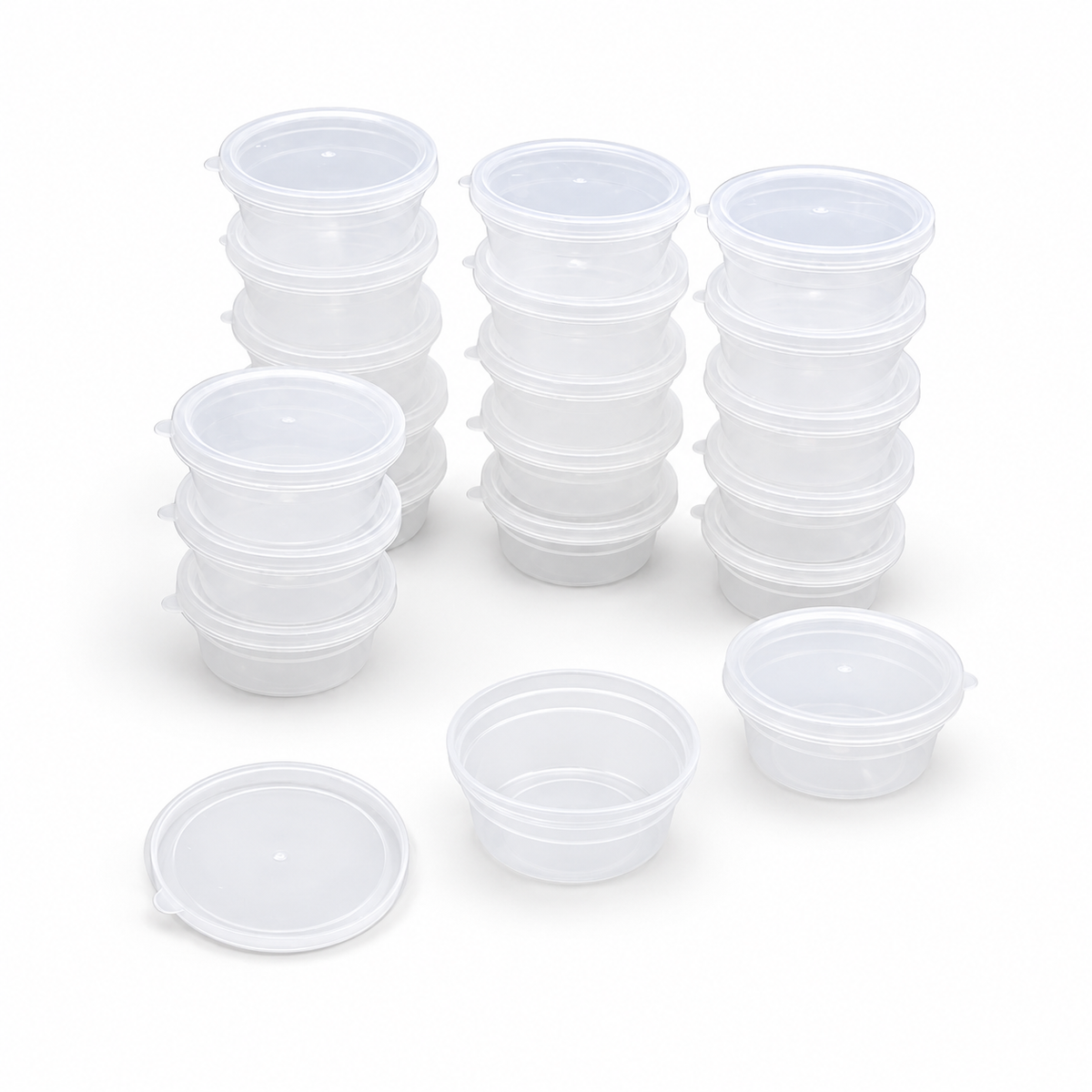 Clear round empty storage boxes with lids on white background