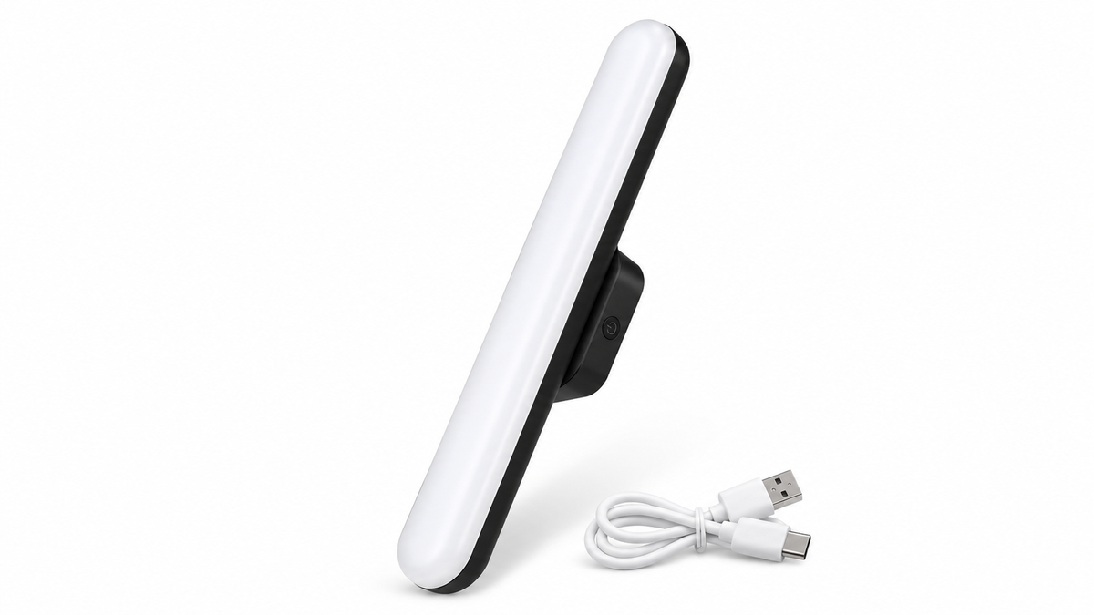 Black rechargeable magnetic LED mirror light with USB cable on a white background