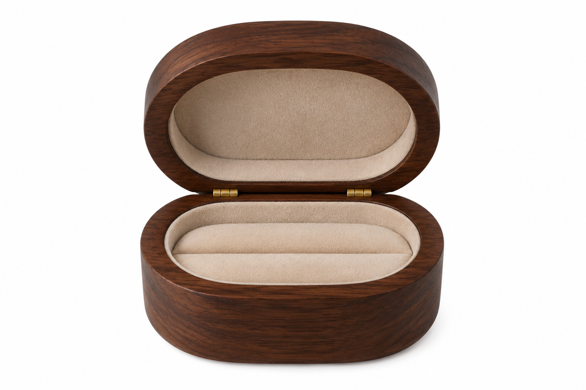 Oval wooden jewelry box on white background