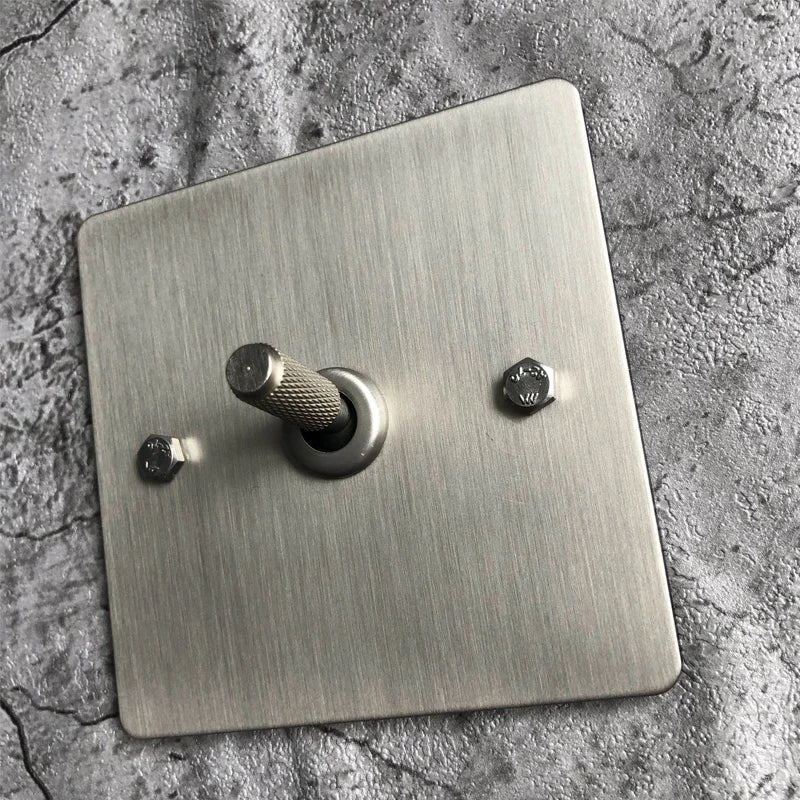 Interruptores de pared, enchufes y accesorios de acero cepillado