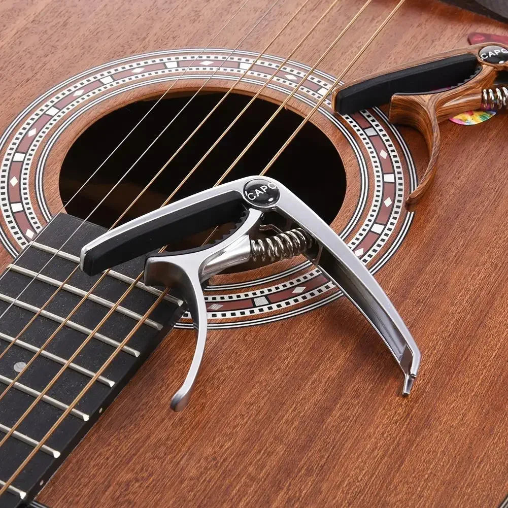 Capotraste de guitarra em metal com suporte para palheta