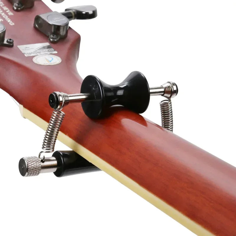 Rolling Guitar Capo with Padded Contact Surfaces