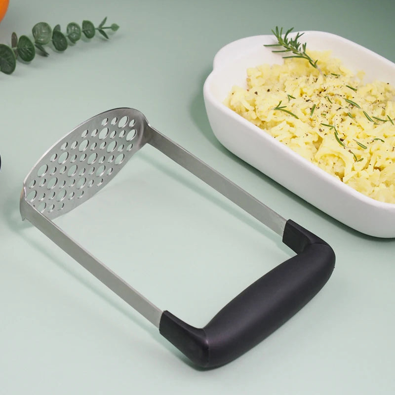 Draagbare aardappelpuree pers