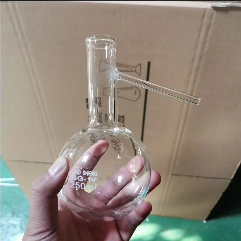Destillationskolben aus Glas mit rundem Boden und Seitenarm