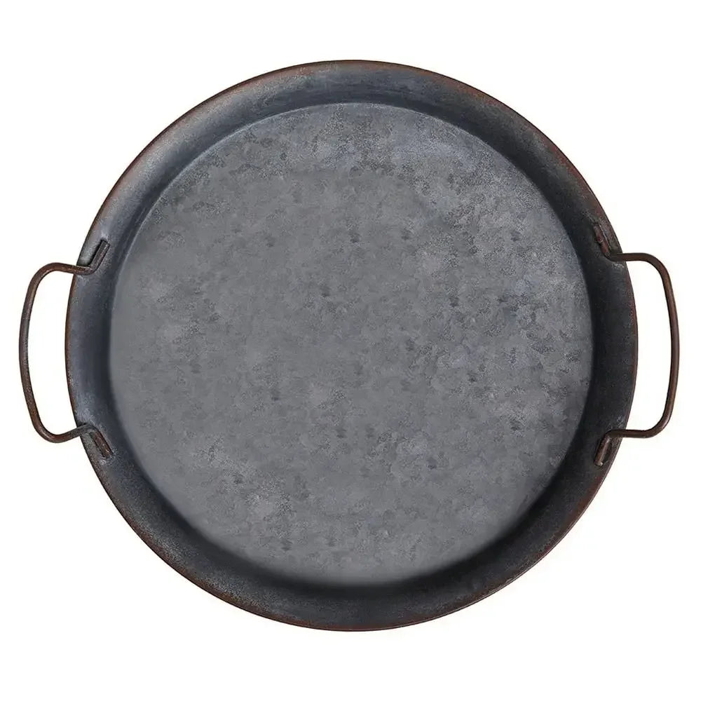 Plate ronde en fer avec poignées pour servir et présenter