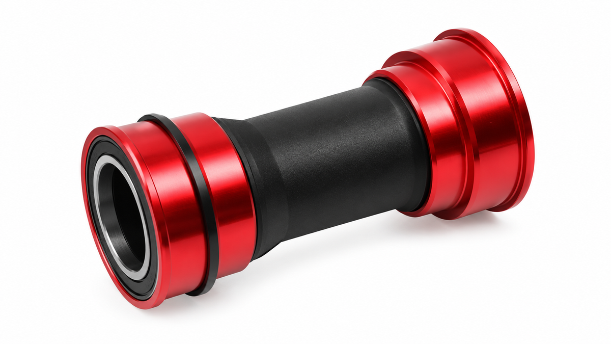 Unbranded red and black BB92 press-fit bicycle bottom bracket on a white background