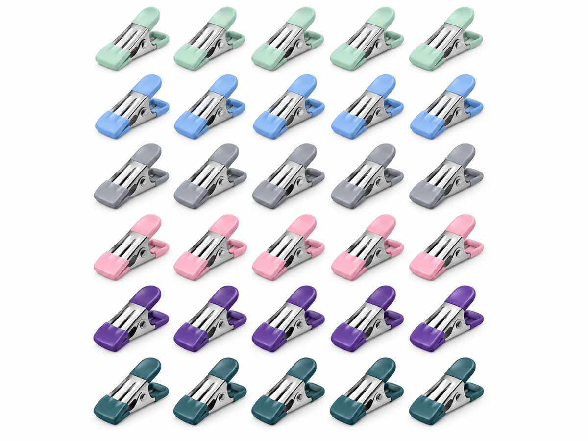 Thirty assorted bag sealing clips with rubber grips on a white background