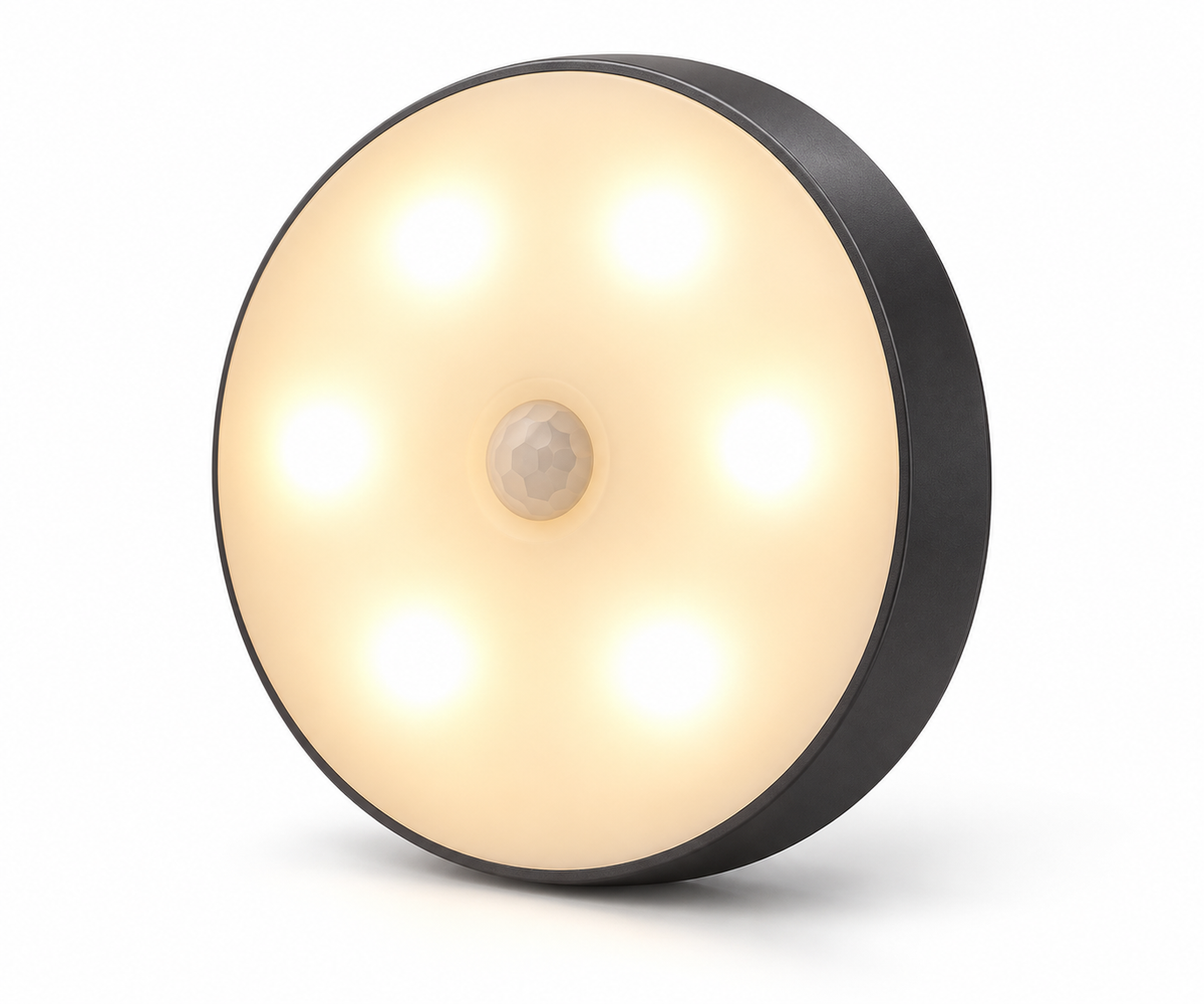 Round rechargeable motion sensor LED light on white background