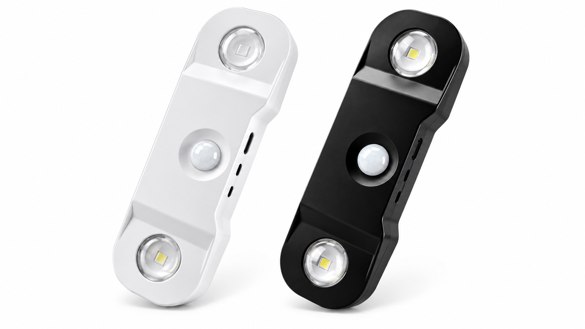 White and black rechargeable motion-sensor wall lights on a white background