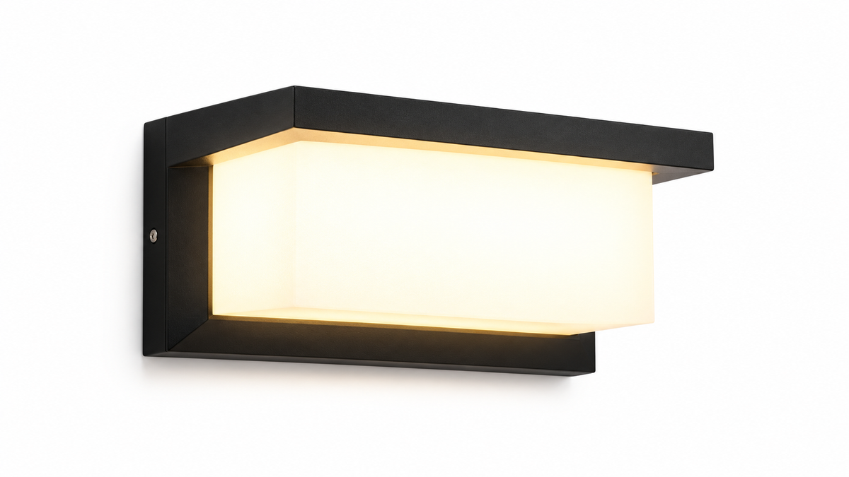 Black rectangular LED wall lamp glowing warm white on a white background