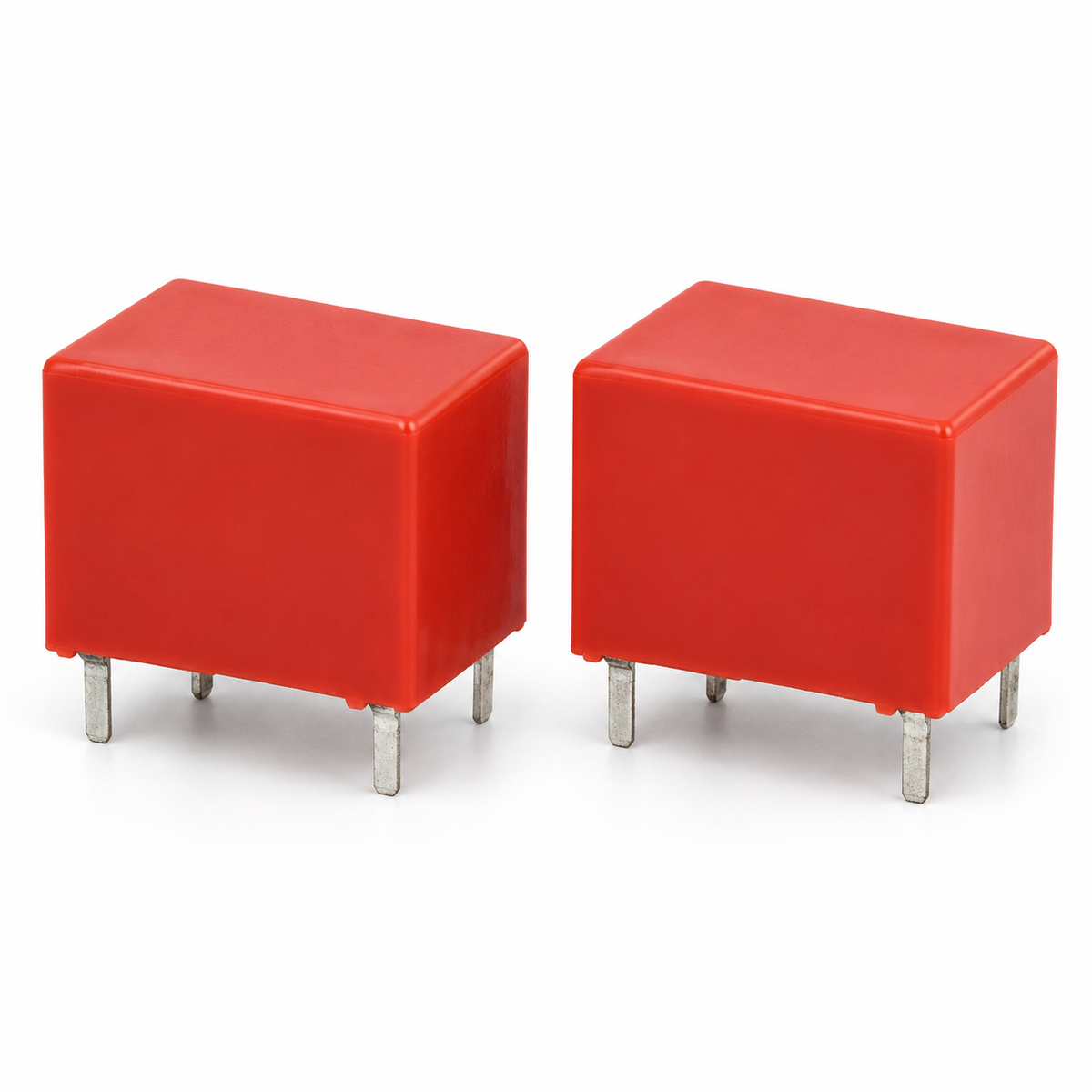 Two red RT424 relays on white background
